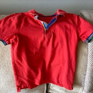 Red collared shirt rainbow detail